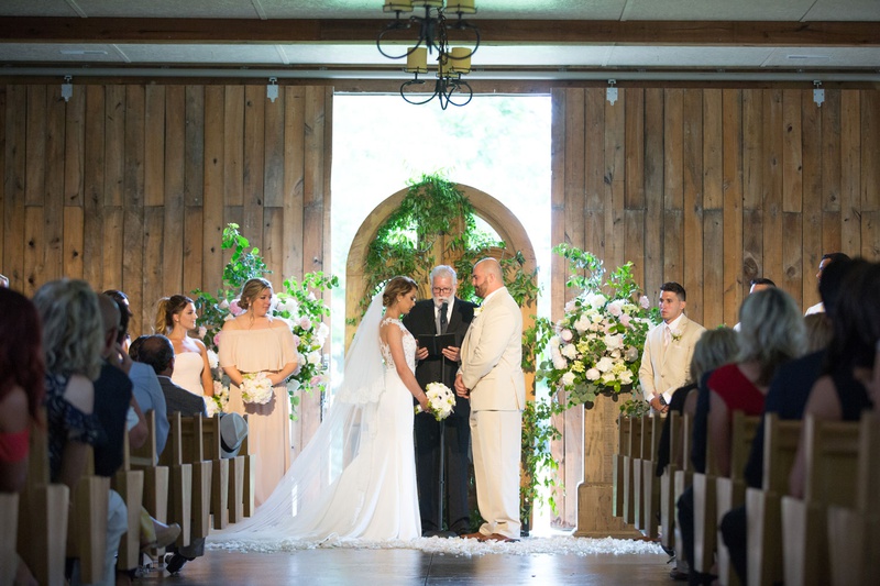 Ceremony in a Barn
Photography: Little Tree Studios
Read More:
http://www.insideweddings.com/weddings/brian-winters-of-the-new-york-jets-romantic-rustic-chic-wedding/1245/ new york jets brian winters wedding, groom in tan suit, bride in pronovias wedding dress, barn