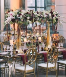 Burgundy and Gold Color Scheme
Photography: Black %26 Hue Photography
Read More:
http://www.insideweddings.com/weddings/church-ceremony-chic-museum-reception-in-palm-beach-florida/1260/ gold pillars with flowers across burgundy white ivory blush