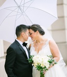 Bride %26 Groom with White Umbrella
Photography: K. Thompson Photography
Read More:
http://www.insideweddings.com/weddings/traditional-ceremony-ballroom-reception-with-blue-gold-decor/1201/ bride and groom portrait rainy day white umbrella tuxedo lace v-neck dress
