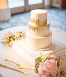 Hand-Painted Gold %26 White Cake
Photography: Lane Dittoe Photography
Read More:
http://www.insideweddings.com/weddings/romantic-garden-party-inspired-summer-wedding-at-a-country-club/967/ Three layer wedding cake round tiers layers gold brushstroke details pink flowers sequin table