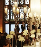 Candelabra Aisle Markers
Photography: KingenSmith
Read More:
http://www.insideweddings.com/weddings/romantic-all-white-celebration-in-chicago-illinois/315/ Silver candle holders on white pedestals