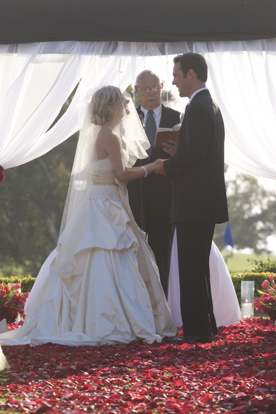 Sunlit Wedding Ceremony
Photography: Ventana Photography
Read More:
http://www.insideweddings.com/weddings/black-and-red-wedding-on-golf-course-at-the-lodge-at-torrey-pines/122/ Bride and groom stand on red flower petals at altar with officiant