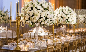 Gold Candelabra %26 Chairs at Reception
Photography: Duke Photography
Read More:
http://www.insideweddings.com/weddings/grand-wedding-with-regal-decor-and-golden-details-in-washington-dc/1117/ Wedding reception with gold chairs tall gold candleabra tall centerpiece white flowers