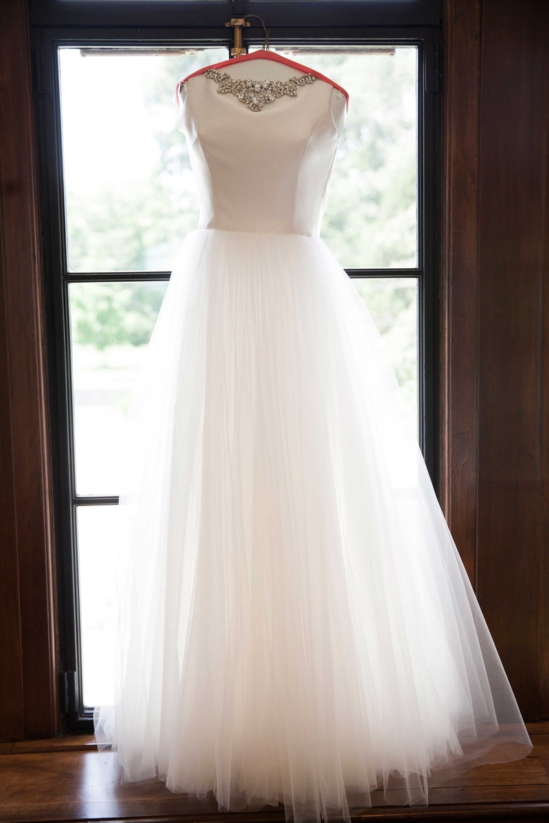 Bride's Second Gown Hung Up
Photography: Michael Bambino %26 Co.
Read More:
http://www.insideweddings.com/weddings/whimsical-open-air-secret-garden-wedding-with-soft-spring-hues/777/ this flowing gown complete with a full tulle skirt was the brides second dress of the evening