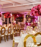 Gold Oval-Back Chairs %26 Pink Blooms
Photography: Amy Anaiz Photography
Read More:
http://www.insideweddings.com/weddings/rooftop-ceremony-glam-reception-with-chic-blooms-in-new-york-city/1019/ Wedding reception all white ballroom with candles candelabra pink fuchsia flower centerpieces