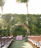 Circular Outdoor Ceremony Structure
Photography: Anastasiia Photography
Read More:
http://www.insideweddings.com/weddings/interfaith-wedding-with-purple-emerald-color-palette-in-florida/1300/ wedding ceremony wood chairs white cushion purple linen circle branch greenery purple flowers unique