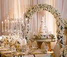 Floral Arch Over Tall Cake
