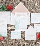Desert-Inspired Invitation Suite
Photography: Koman Photography
Read More:
http://www.insideweddings.com/weddings/boho-chic-inspirational-wedding-with-desert-details-and-soft-colors/1137/ desert inspired invitation suite with watercolor cactus and gold calligraphy