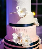 Ombré Wedding Cake with Navy Ribbon
Photography: George Street Photo %26 Video
Read More:
http://www.insideweddings.com/weddings/high-school-sweethearts-wed-in-romantic-ceremony-on-a-yacht/883/ pink ombre cake with navy ribbon, gum paste flowers luster dust, dots, touch of gold
