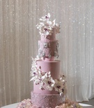 Lavender Wedding Confection
Photography: Collin Pierson Photography
Read More:
http://www.insideweddings.com/weddings/styled-spring-wedding-shoot-with-lavender-blush-silver-decor/1114/ Purple wedding cake with silver details decorations and cascading white purple sugar flowers