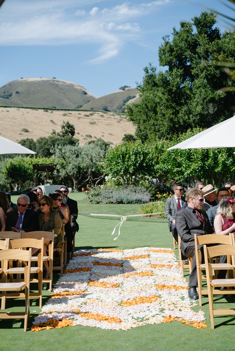 Flower Petal-Lined Aisle in Chevron Pattern
Photography: Karlisch Photography
Read More:
http://www.insideweddings.com/weddings/modern-rustic-wedding-full-of-flowers-and-geometric-details/906/ orange, blush, and white flower petals form chevron-patterned aisle