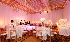 Blush Lighting in Ballroom
Photography: Brian Leahy Photography
Read More:
http://www.insideweddings.com/weddings/a-classic-romantic-celebration-with-lush-florals-in-beverly-hills/973/ Pink lighting in ballroom wedding reception room with white flowers, live band