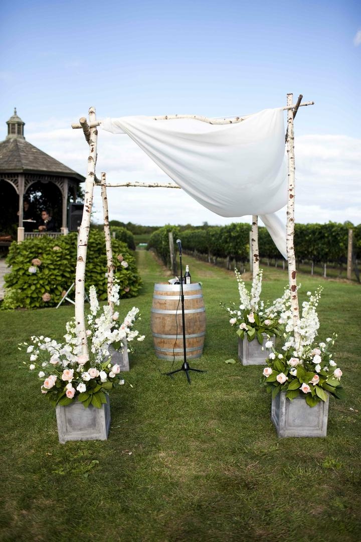 Birch Poles And Rustic Pots Filled With Flowers Birch Poles And Rustic Pots Filled With Flowers