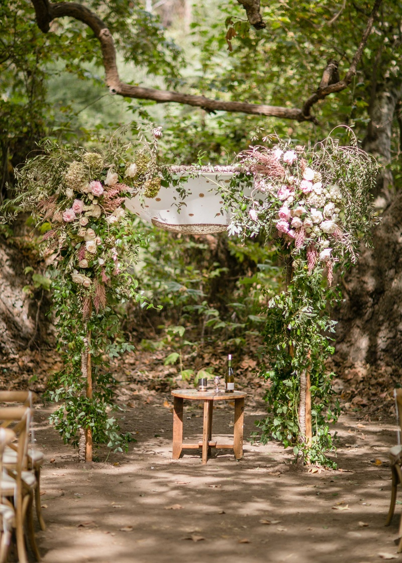 Natural Chuppah for Jewish Wedding
Photography: Samuel Lippke Studios
Read More:
http://www.insideweddings.com/weddings/a-rustic-camp-themed-outdoor-wedding/908/ Outdoor Jewish wedding ceremony chuppah made of tree branches pink flowers greenery wood table under