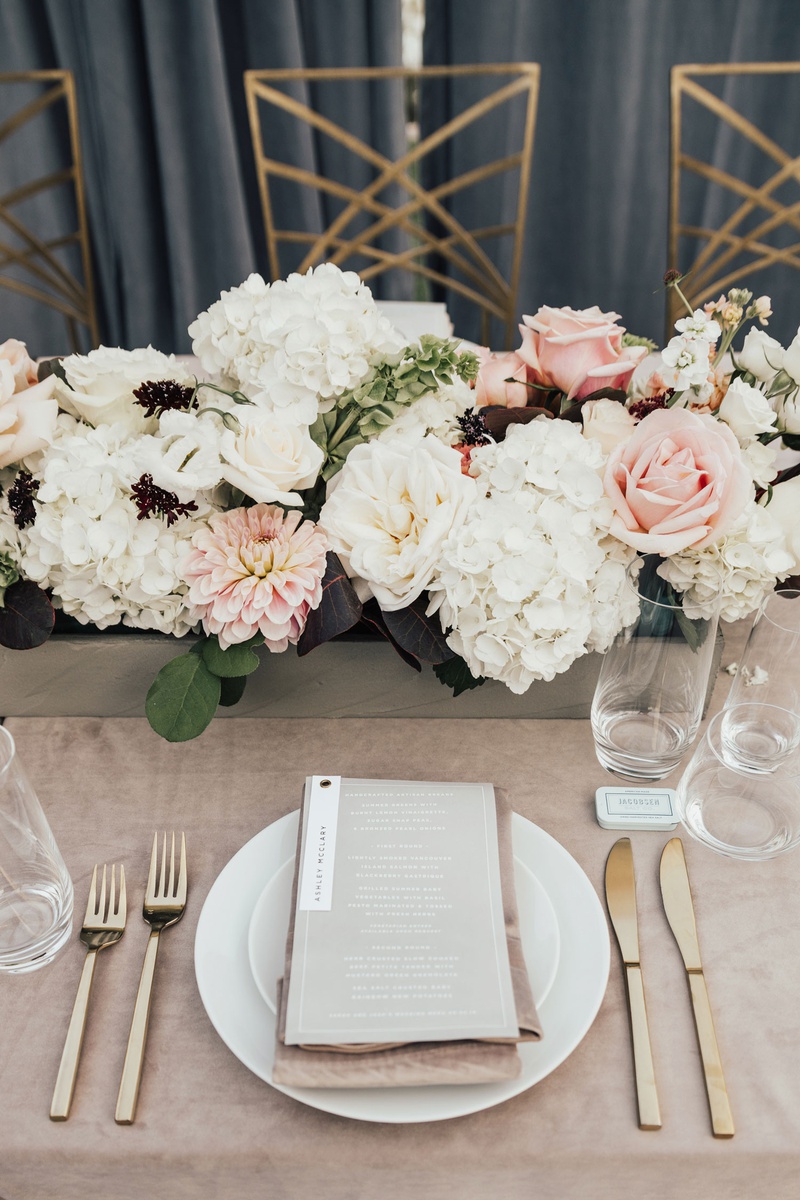 White, Pink %26 Burgundy Low Centerpiece
Photography: Sam %26 Sola Lee Photography
Read More:
http://www.insideweddings.com/weddings/modern-outdoor-ceremony-tent-reception-in-seattle-on-puget-sound/1309/ wedding reception place setting gold flatware flower box white hydrangea pink rose dahlia burgundy