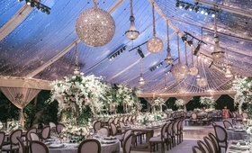 Twinkling Lights on Clear-Top Tent
Photography: Jessica Claire Photography
Read More:
http://www.insideweddings.com/weddings/destination-la-wedding-with-natural-rustic-organic-decor/1134/ wedding reception tent clear top chandeliers string lights rustic elegant decor tent reception