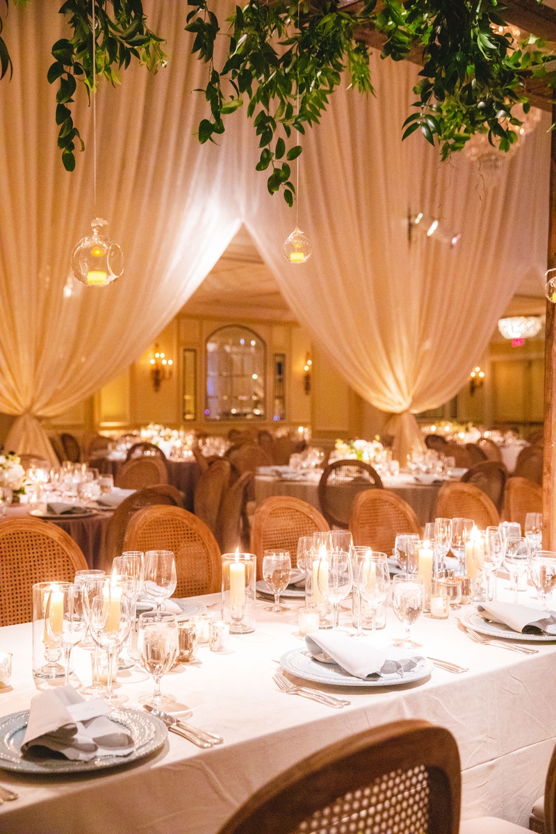Cane-Back Chairs %26 Greenery Overhead
Photography: Mantas Kubilinskas Photography
Read More:
http://www.insideweddings.com/weddings/sophisticated-ceremony-ballroom-reception-in-washington-dc/1296/ wedding reception greenery glass orb candles overhead long table wood cane chairs candles low flower