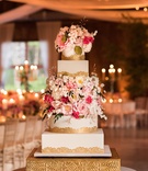Wedding Cake with Alternating Shapes
Photography: Ira Lippke Studios
Read More:
http://www.insideweddings.com/weddings/a-lakeside-black-tie-wedding-with-a-summer-camp-theme/938/ ron ben israel cake with square and round layers, gold trim, sugar flowers