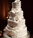 White Ribbon Cake
Photography: Tina Rowden
Read More:
http://www.insideweddings.com/weddings/alexandria-lopez-and-joshua-smith/356/ Four layer white cake with orchids and ribbons
