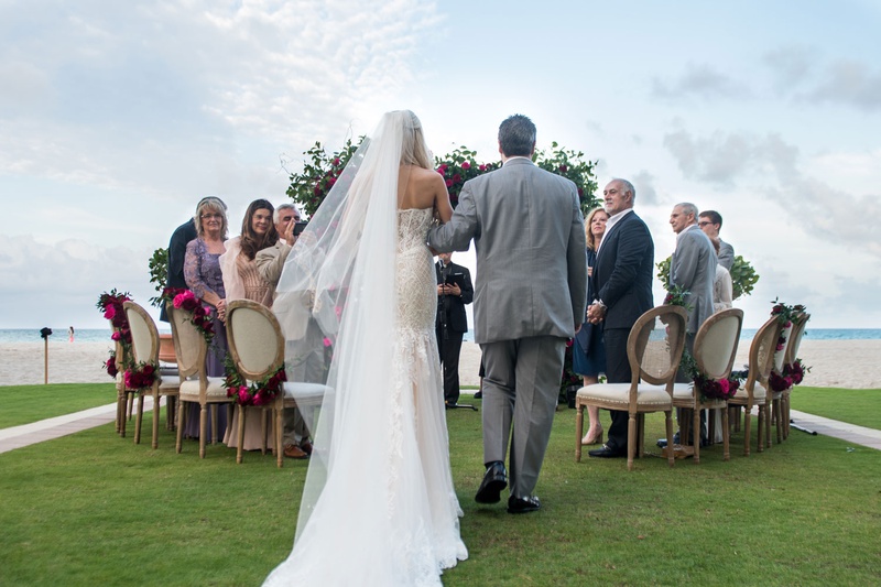 Walk Down the Aisle for Intimate Wedding
Photography: Suzanne Delawar Studios
Read More:
http://www.insideweddings.com/weddings/intimate-oceanfront-wedding-with-romantic-red-pink-white-palette/1235/ bride in strapless wedding dress long veil with father in grey suit oceanfront wedding acqualina
