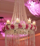 Crystal Chandelier with Roses
Photography: David Michael Photography
Read More:
http://www.insideweddings.com/weddings/glitzy-ballroom-wedding-at-the-st-regis-monarch-beach/136/ Chandeliers hanging from ballroom's ceiling