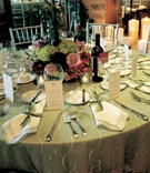 Reception Table Decor
Photography: Lena Hyde Photography
Read More:
http://www.insideweddings.com/weddings/lavender-burgundy-spring-wedding-at-golf-club-in-florida/142/ Wedding reception table with green tablecloth and red, green, and lavender flowers