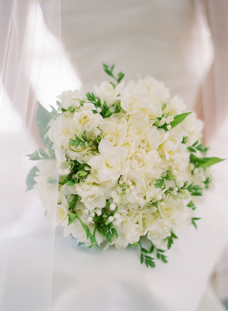 Classic Ivory Bouquet with Greenery
Photography: Michelle Beller Photography
Read More:
http://www.insideweddings.com/weddings/classic-ceremony-beachfront-ballroom-reception-in-santa-monica/1234/ classic wedding bouquet with white flowers roses lily of the valley and greenery behind veil