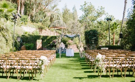 Outdoor Ceremony Surrounded by Trees
Photography: Wild Whim Design + Photography
Read More:
http://www.insideweddings.com/weddings/outdoor-bohemian-fall-wedding-at-a-magical-venue-in-los-angeles/1238/ wedding ceremony wood vineyard chairs grass lawn houdini estate chuppah pampas grass palm trees