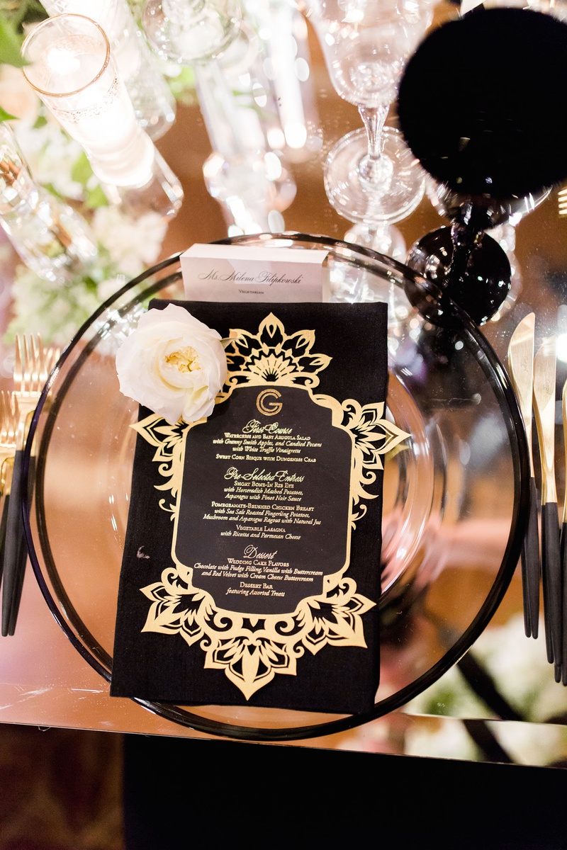Black Napkin %26 Gold Laser-Cut Menu
Photography: Brett Hickman Photographers
Read More:
http://www.insideweddings.com/weddings/charlise-castro-and-george-springer-iii/1165/ Mirror table black goblet glassware gold menu card monogram fresh flower black gold flatware candles