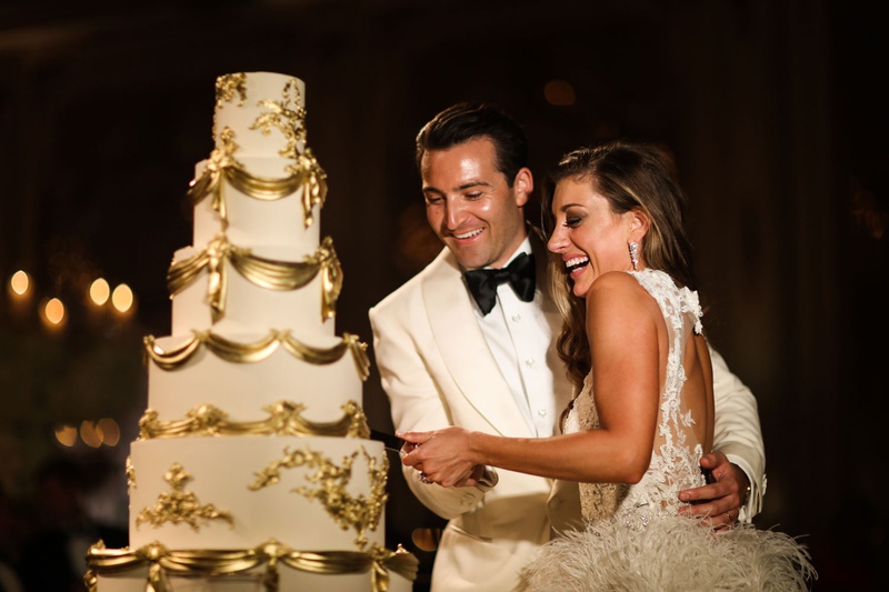 Luxury Wedding Cake Cutting
Photography: Alain Martinez Photography
Read More:
http://www.insideweddings.com/weddings/opulent-luxury-wedding-with-white-gold-color-scheme-in-palm-beach/1375/ bride in ostrich feather skirt monique lhuillier groom white tuxedo white gold wedding cake regal