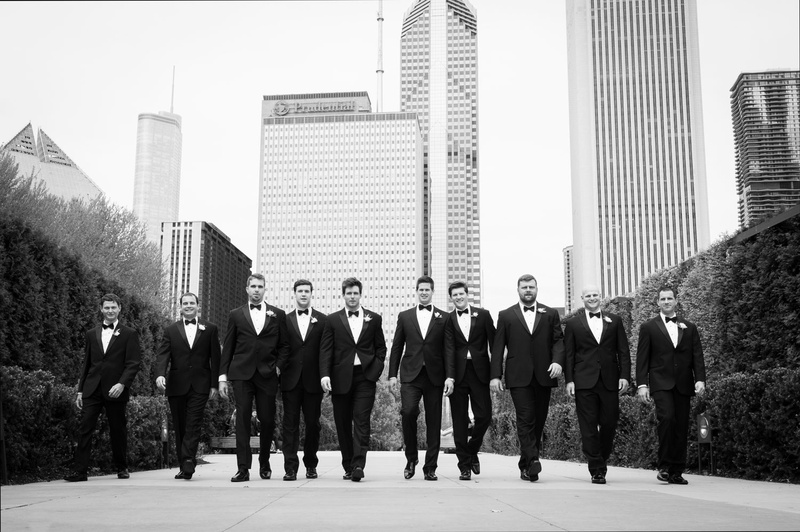 Groomsmen Stroll Through Chicago
Photography: Carasco Photography
Read More:
http://www.insideweddings.com/weddings/traditional-ceremony-glamorous-garden-inspired-tented-reception/943/ Black and white photo of groom and groomsmen walking through city of Chicago