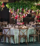 Inverted Floral Centerpiece
Photography: Kent Drake Photography
Read More:
http://www.insideweddings.com/weddings/bright-and-colorful-wedding-palette-with-ceremony-overlooking-lake/1315/ wedding reception table with vineyard chairs, inverted floral arrangement with greenery