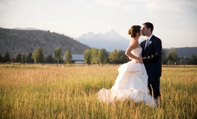 Newlyweds Kiss in Jackson Hole
Photography: Carrie Patterson Photography
Read More:
http://www.insideweddings.com/weddings/tented-wedding-with-nature-inspired-decor-in-jackson-hole-wyoming/244/ Wedding dress with bustle and Grand Teton