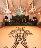 Elaborate Monogram on Dance Floor
Photography: Mikel Healey Photography
Read More:
http://www.insideweddings.com/weddings/romantic-secret-garden-inspired-wedding-in-southern-california/1341/ dance floor with large, ornate monogram in black, chandeliers above