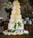 Six Layer Cake with Fresh Ivory Flowers
Photography: Chris Bailey Photography
Read More:
http://www.insideweddings.com/weddings/southern-at-home-wedding-inspired-by-father-of-the-bride-in-texas/753/ Six tier white wedding cake with fresh cascading rose and orchid flowers