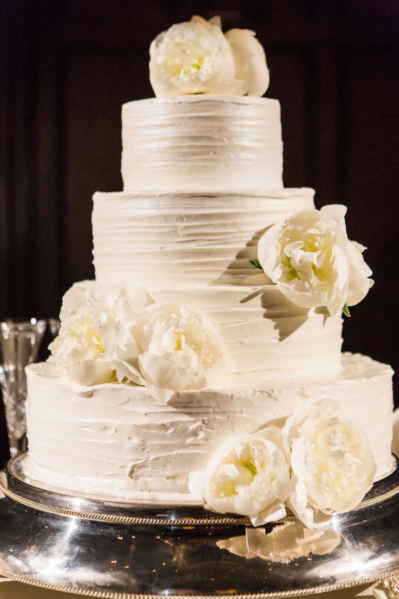 Four-Layer Cake with Peonies
Photography: Vue Photography
Read More:
http://www.insideweddings.com/weddings/summer-destination-wedding-with-rustic-elegant-decor-in-georgia/1032/ Four layer buttercream frosting wedding cake with fresh flowers peony blooms on top and tier lemon