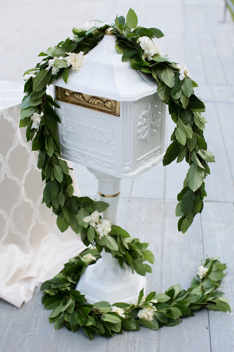 Letter Mailbox for Gift Envelopes
Photography: Sarah Kate, Photographer
Read More:
http://www.insideweddings.com/weddings/outdoor-fall-ceremony-opulent-tented-reception-in-dallas-texas/1022/ Wedding gift box area garland of greenery ivory flowers white letter box gold details hardware