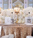 Gold Sequin Wedding Table
Photography: Milanés Photography
Read More:
http://www.insideweddings.com/weddings/white-silver-gold-wedding-at-the-biltmore-ballrooms-in-atlanta/680/ Sweetheart table with Jones soda bottles and gold tablecloth