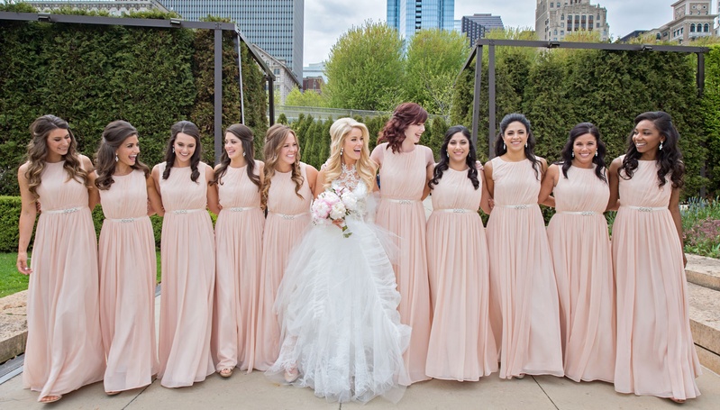 10 Bridesmaids in Blush
Photography: Carasco Photography
Read More:
http://www.insideweddings.com/weddings/traditional-ceremony-glamorous-garden-inspired-tented-reception/943/ Bride in middle of ten bridesmaids in long blush light pink gowns