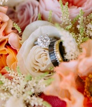 Wedding Jewelry in Summer Bridal Bouquet
Photography: Ashley Paige Photography
Read More:
http://www.insideweddings.com/weddings/romantic-ocean-view-ceremony-charming-reception-in-california/1337/ bridal bouquet white pink orange flowers round solitaire engagement ring men's band black gold