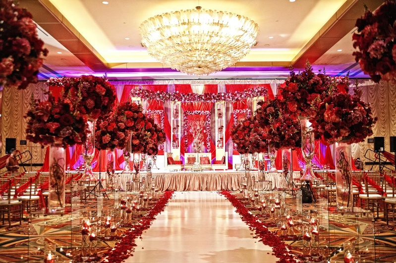 Ceremony Décor
Photography: Tomas Ramos Photographers
Read More:
http://www.insideweddings.com/weddings/houston-indian-wedding-celebration-with-800-person-guest-list/435/ Indian wedding ceremony with red floral arrangements lining the aisle