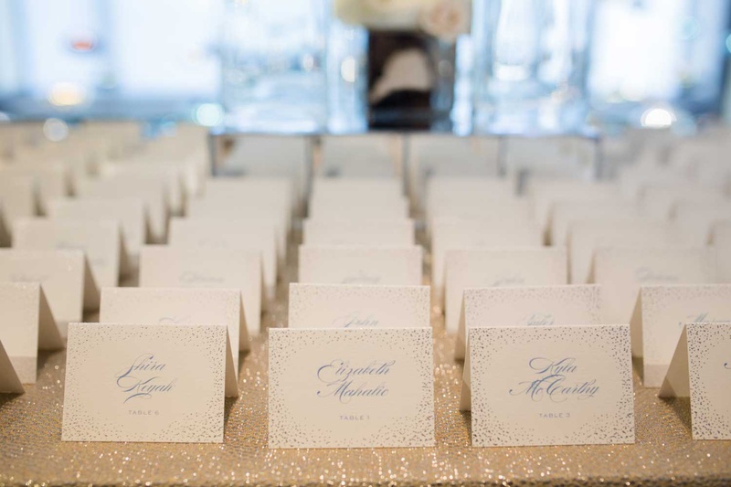 Light Blue Calligraphy Escort Cards
Photography: Studio This Is
Read More:
http://www.insideweddings.com/weddings/glamorous-city-style-real-wedding-at-a-luxury-hotel-in-chicago/1217/ wedding escort cards on sparkly linen light blue confetti motif light blue calligraphy