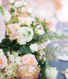 Close Up of Peach Wedding Centerpiece
Photography: Switzerfilm
Read More:
http://www.insideweddings.com/weddings/romantic-greenhouse-inspired-wedding-with-a-spring-color-palette/1352/ wedding reception blue table linen pink peach white ivory flowers rose hydrangea candle votives
