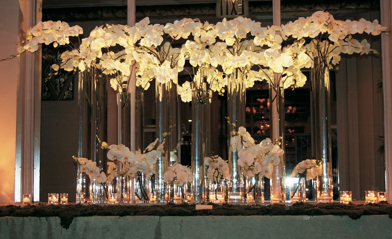 Escort Card Display
Photography: Gruber Photographers
Read More:
http://www.insideweddings.com/weddings/english-garden-inspired-fall-wedding-in-new-york-city/210/ Tall vase holding orchids on long table