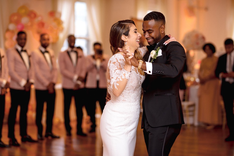 Smiles During First Dance
Photography: Kesha Lambert Photography
Read More:
http://www.insideweddings.com/weddings/personalized-ceremony-with-pink-florals-at-a-loft-in-new-york-city/1210/ bride in pronovias mermaid wedding dress with lace bodice, groom in tuxedo, first dance