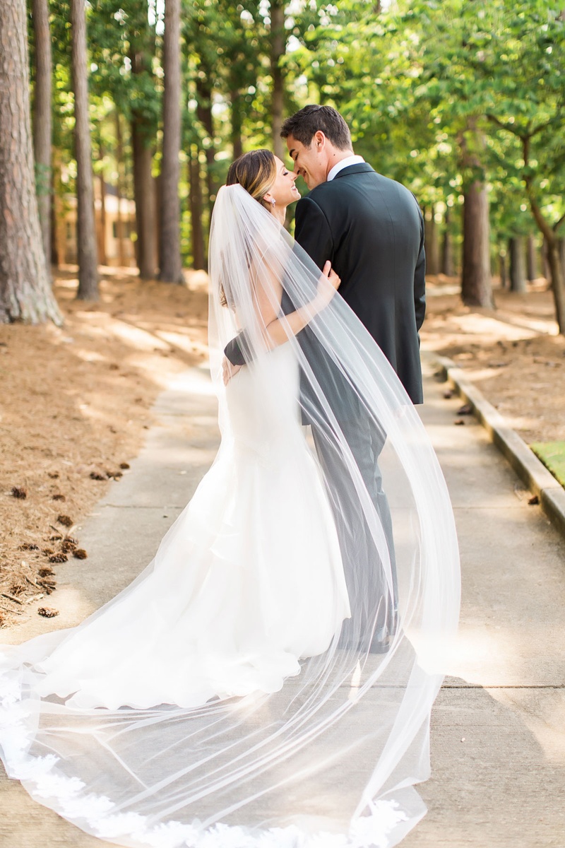 Gorgeous Lace-Trim Veil
Photography: Vue Photography
Read More:
http://www.insideweddings.com/weddings/summer-destination-wedding-with-rustic-elegant-decor-in-georgia/1032/ Couple portrait in wooded area forest camp with sheer veil and lace trim hem