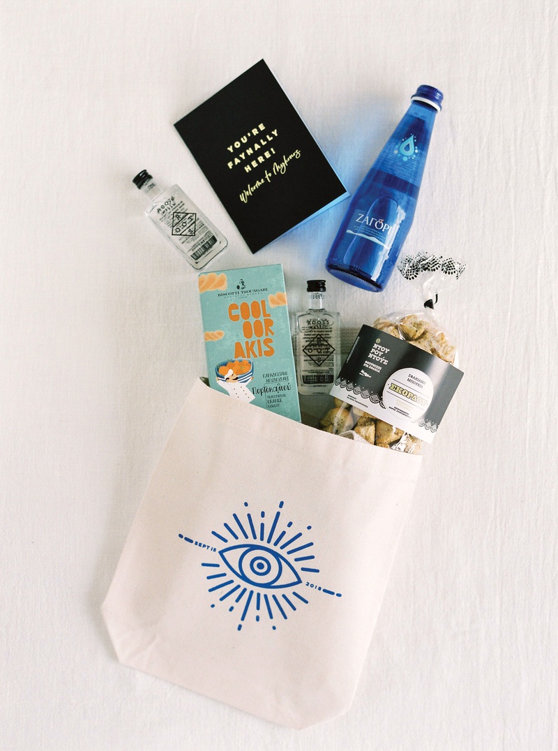 Greek-Themed Wedding Welcome Bag
Photography: Branco Prata
Read More:
http://www.insideweddings.com/weddings/luxe-destination-wedding-with-view-of-aegean-sea-in-mykonos-greece/1372/ mykonos wedding welcome bag evil eye tote greek water alcohol snacks and cookies