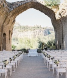 Ceremony Overlooking Orvieto, Italy
Photography: Rochelle Cheever
Read More:
http://www.insideweddings.com/weddings/charming-romantic-outdoor-destination-wedding-in-italy/1316/ XII century Benedictine Abbey hotel countryside view umbria italy stone ruins white chairs purple