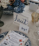 DIY Table Numbers at Escort Cards
Photography: Joel %26 Justyna
Read More:
http://www.insideweddings.com/weddings/french-inspired-tented-wedding-at-the-brides-family-vacation-home/1195/ wedding reception french number table numbers blue paint lettering escort cards menu illustration