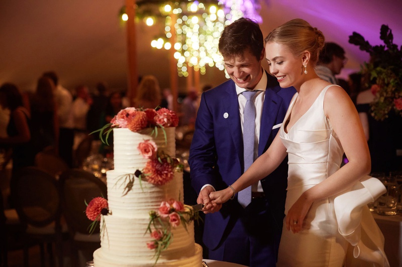 Bride %26 Groom Cutting Classic Cake
Photography: Christian Oth Studio
Read More:
http://www.insideweddings.com/weddings/timeless-wedding-with-garden-inspired-decor-in-the-hamptons/1237/ wedding photo of bride and groom cutting into white buttercream wedding cake decorated pink flowers
